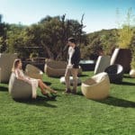 Vondom - STONE collection showing sofa, lounge chairs in many colors, coffee table, and various planters